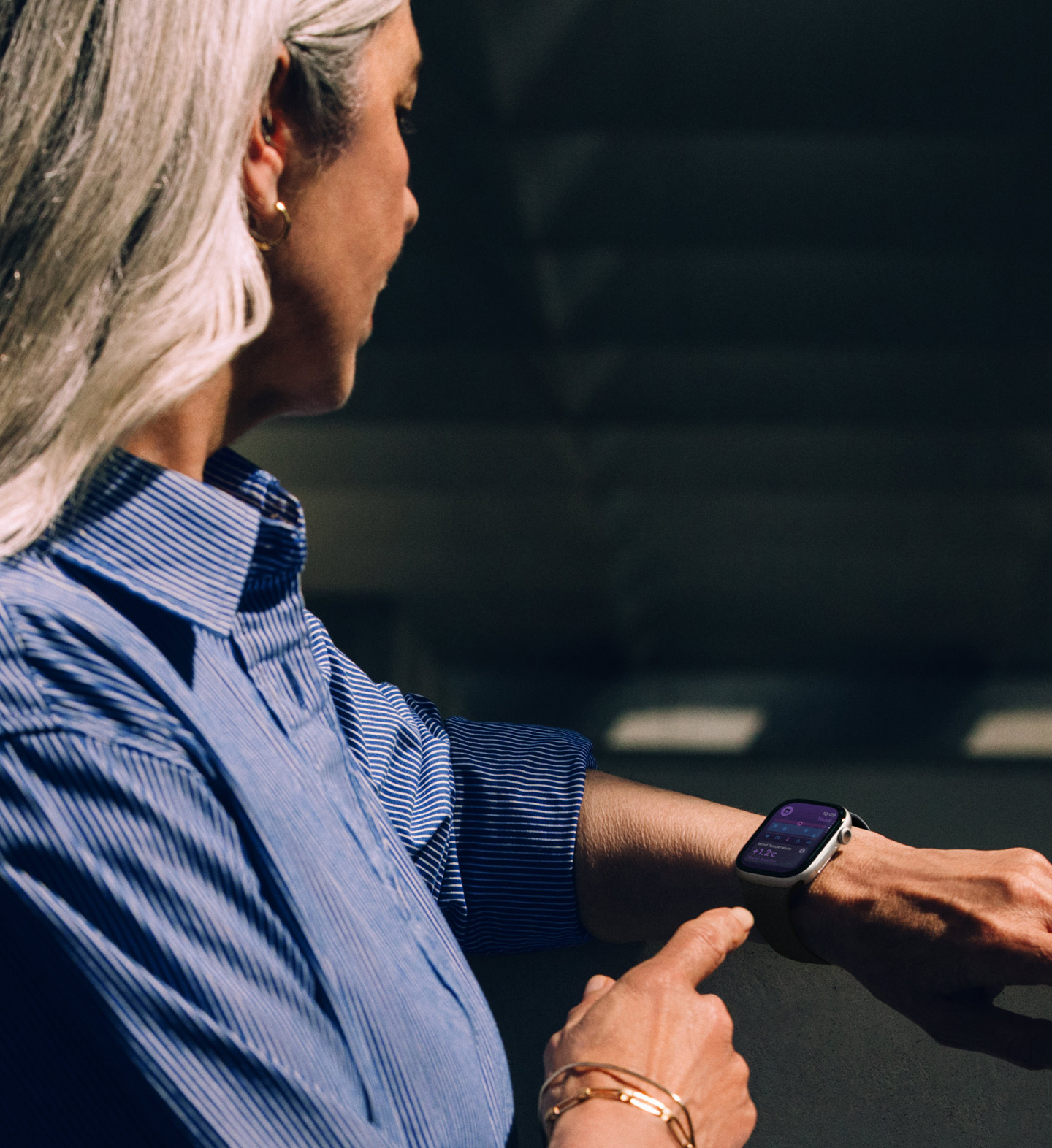 A person reads a hypertension notification on their Apple Watch Series 11
