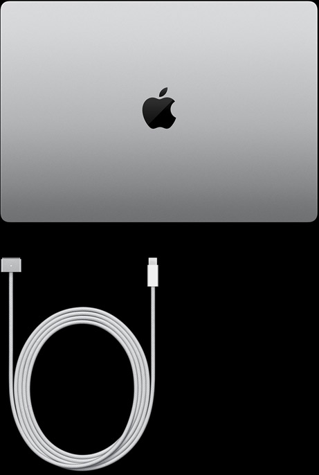 MacBook Pro, Farbe Silber, Oberseite, geschlossen, neben Ladekabel und Netzteil