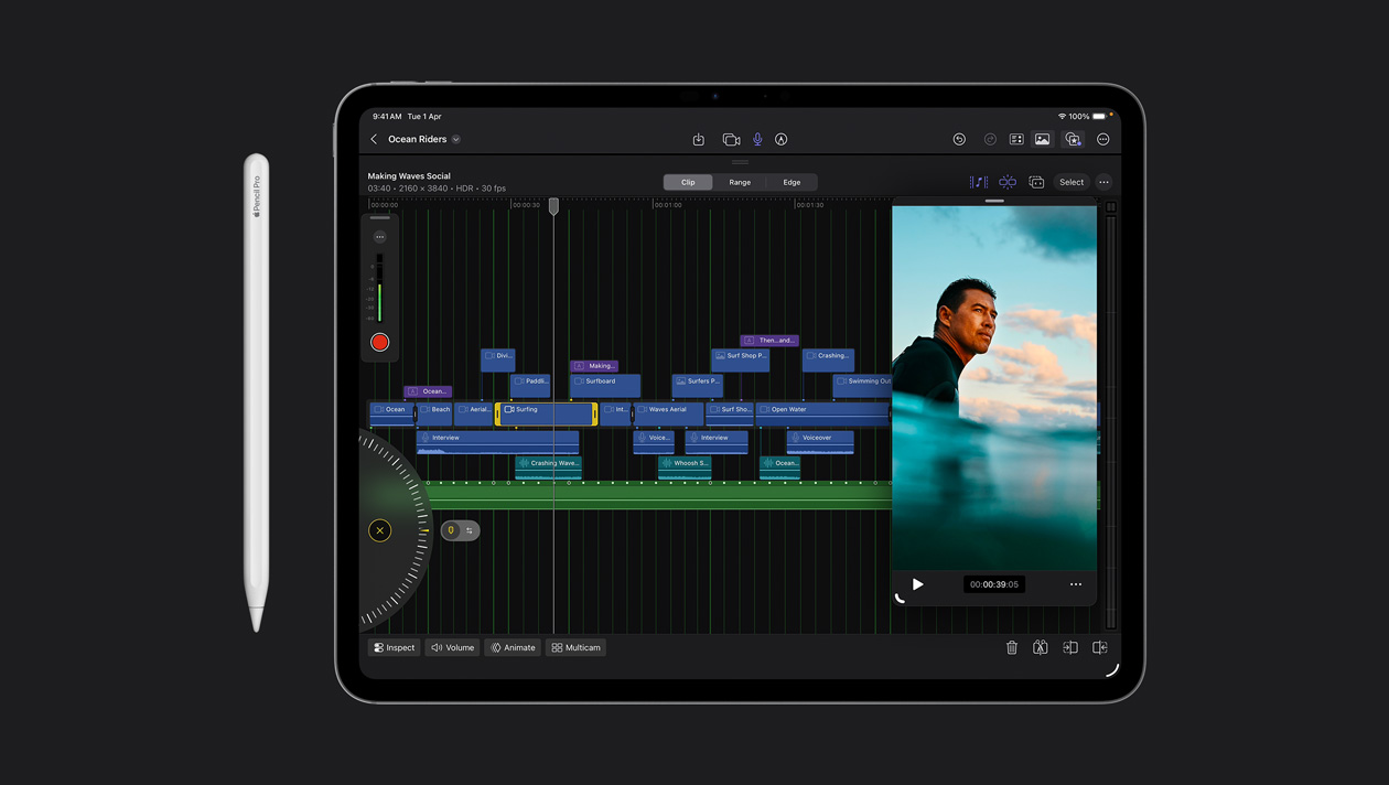 iPad Pro 13 screen showing organised video clips in different colours, image of surfer in the ocean on the right, Apple Pencil to the left of the device