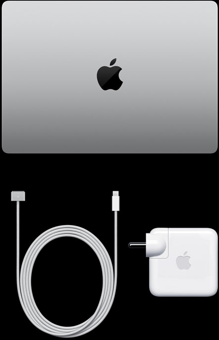MacBook Pro, silver colour, top, closed, next to charging cable and adapter