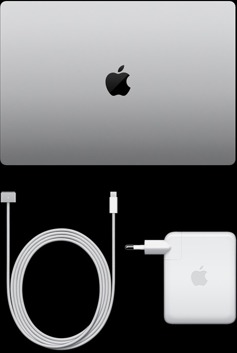 MacBook Pro, 실버 색상, 상단, 닫혀 있는 상태, 옆에 충전 케이블과 어댑터가 놓여 있습니다