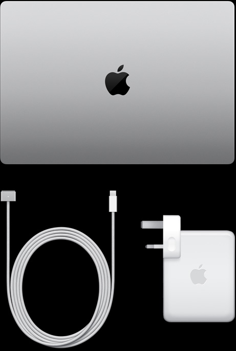 MacBook Pro, silver color, top, closed, next to charging cable and adapter