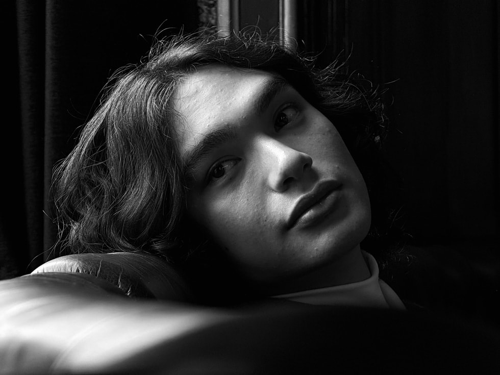 A person captured in black and white with the 5x Telephoto camera on iPhone 15 Pro Max.