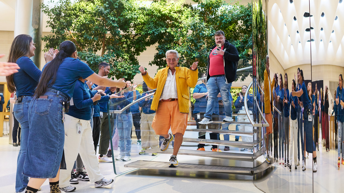 A customer walks down the stairs inside Apple Fifth Avenue in New York City.