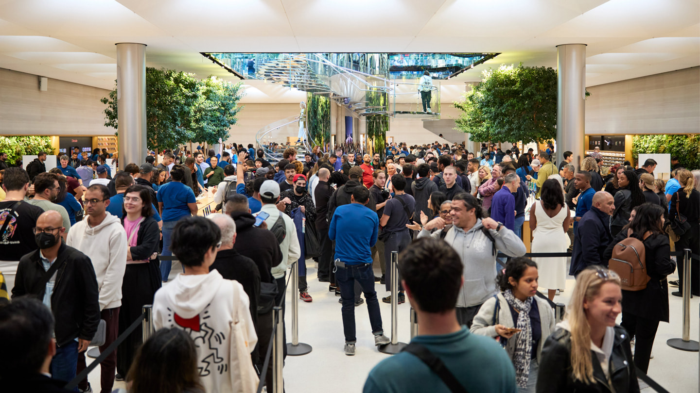 Customers line up inside the bustling Apple Fifth Avenue in New York City.