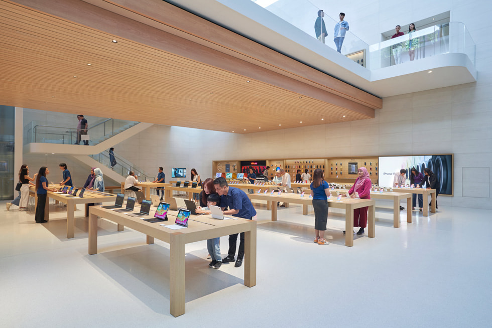 Customers explore the latest iPad models and iPhone 15 lineup inside Apple The Exchange TRX.