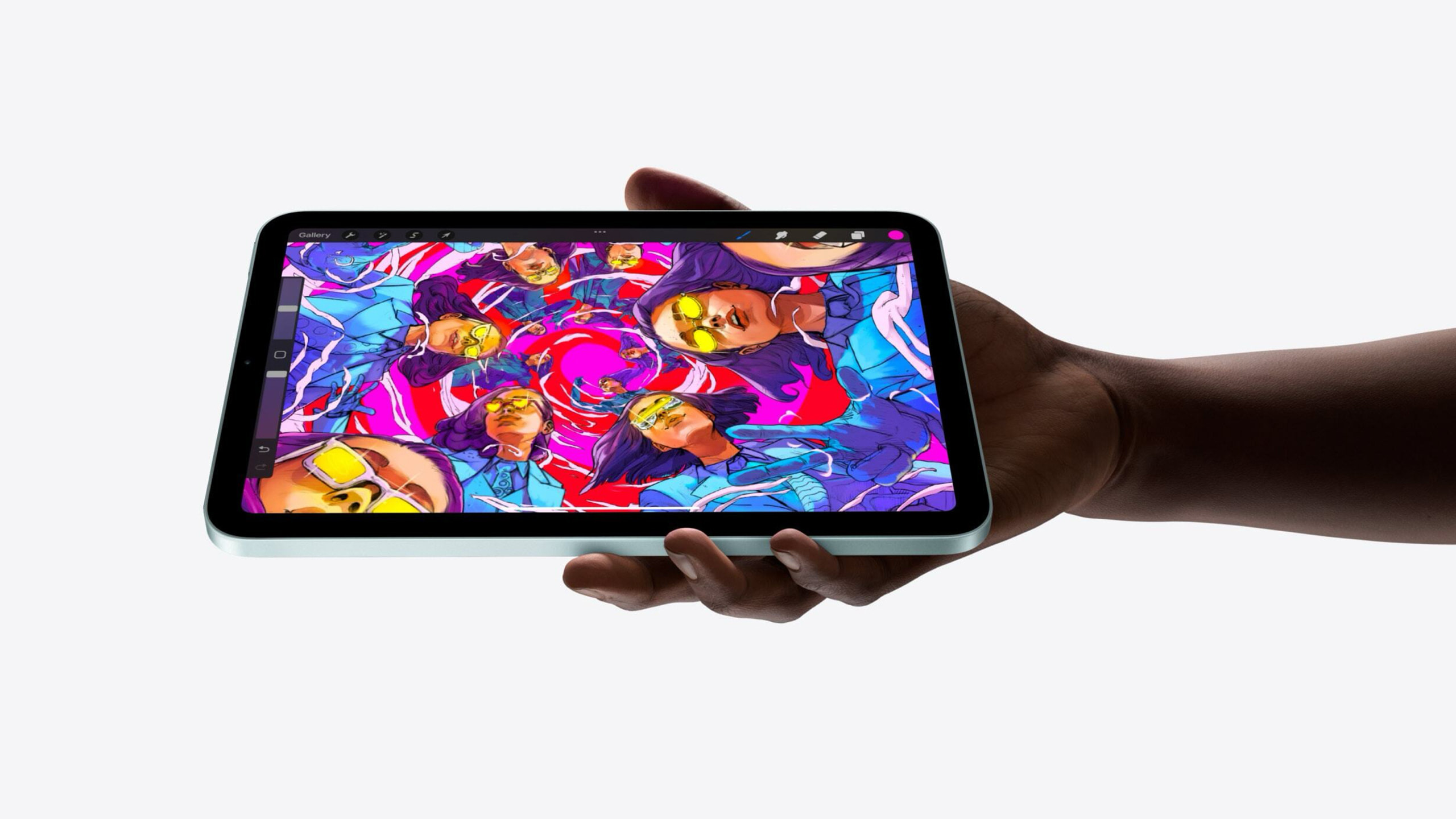 A person holding the new iPad mini.