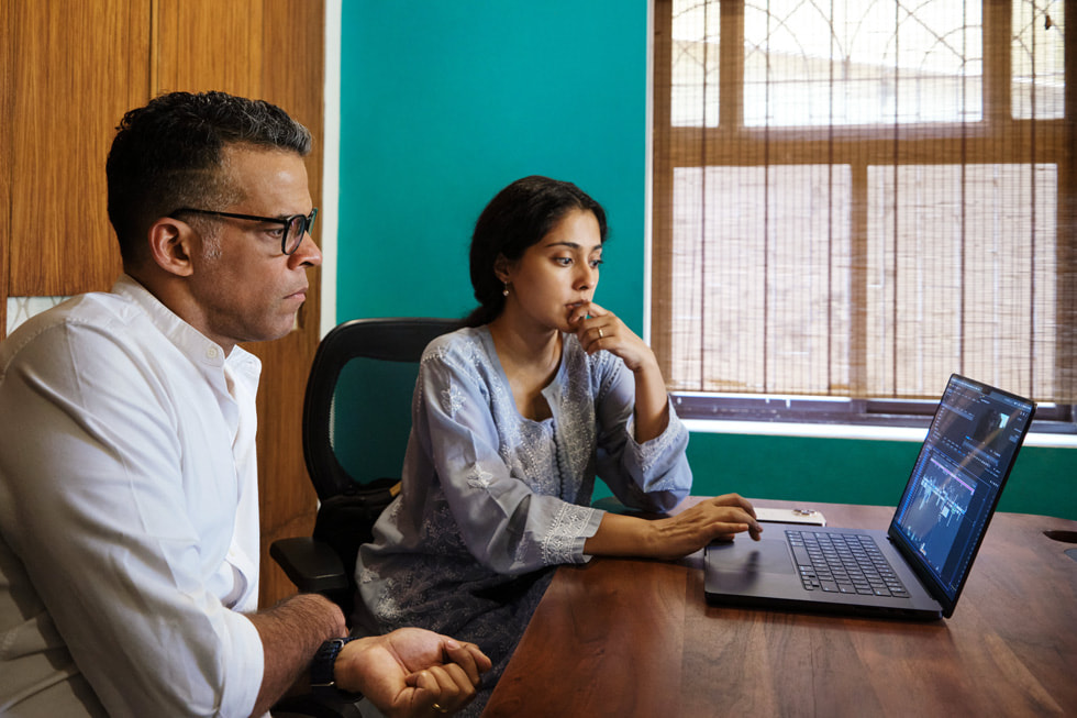 Amrita Bagchi with her mentor, Vikramaditya Motwane, looking at footage on MacBook Pro.