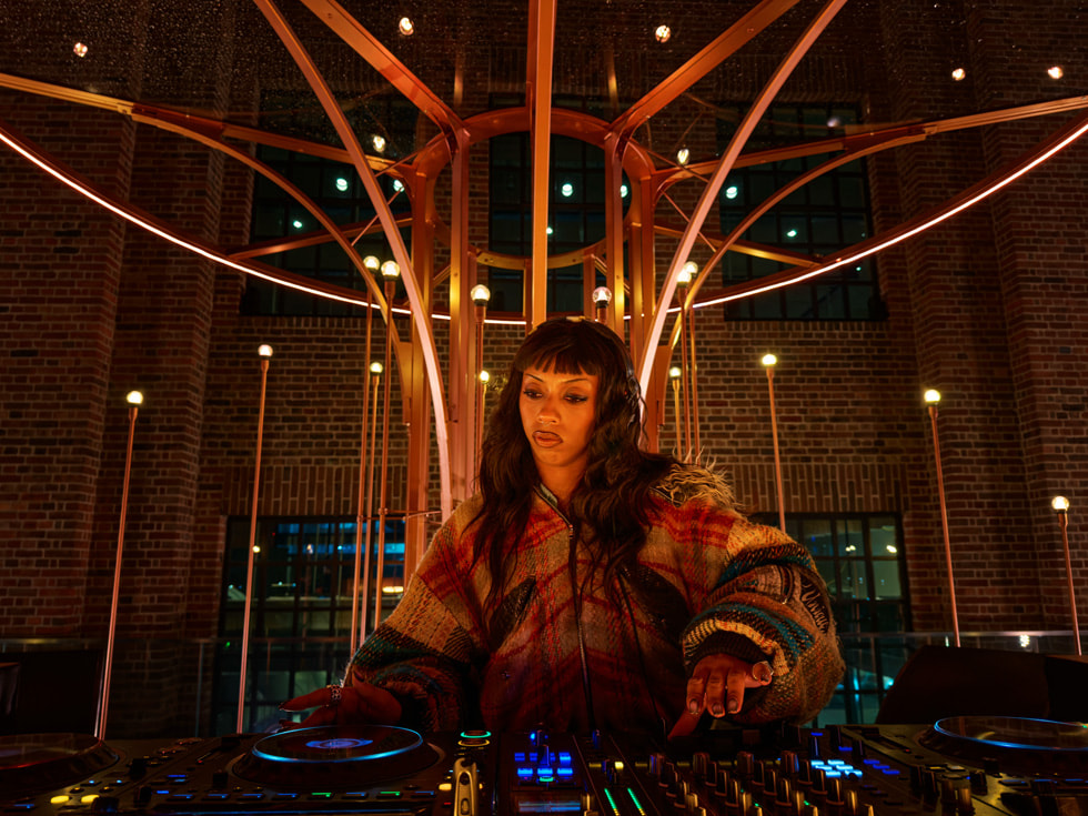 Nia Archives is pictured DJing at Apple Battersea in London.