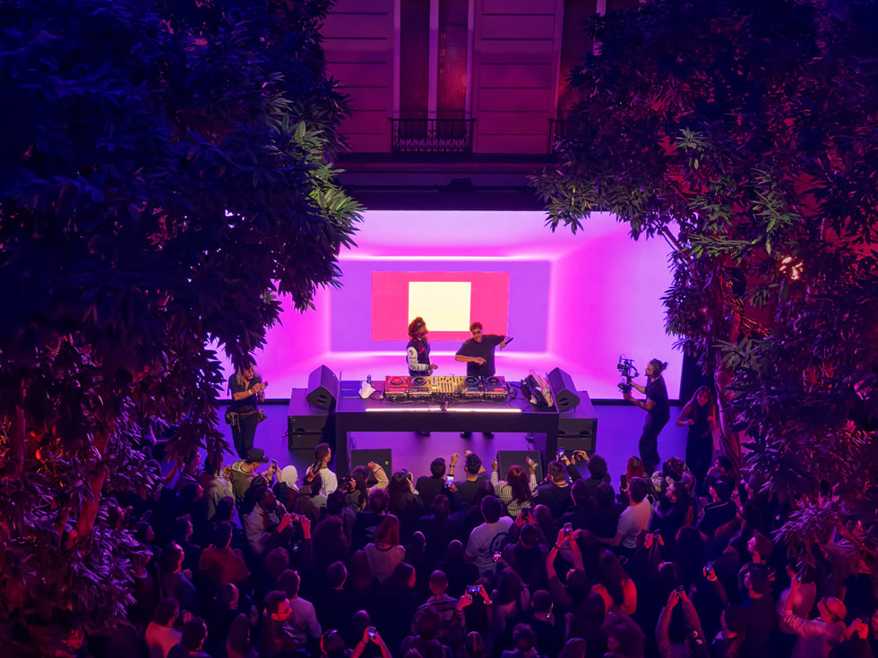 Andy 4000 and disiz are pictured on the stage at Apple Champs-Élysées in Paris.