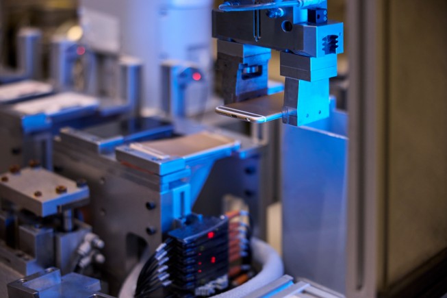 A close-up of a Daisy recycling robot.