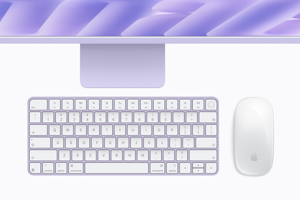M6 çipli mor iMac ve altında aynı renkte klavye ve mouse gösteriliyor.