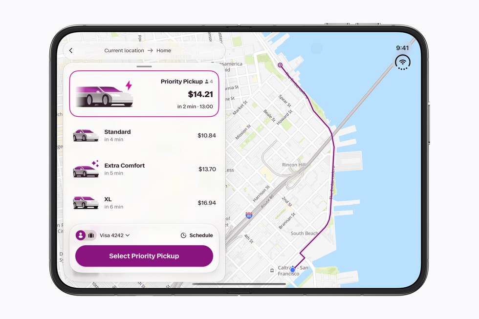 A fully flat open iPhone Duo shows the Lyft app.