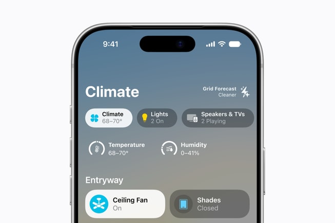 An iPhone 18 Pro shows a set of widgets from the Home app displaying room temperatures and energy usage, including speakers, TVs, and a ceiling fan, taken across multiple indoor spaces.