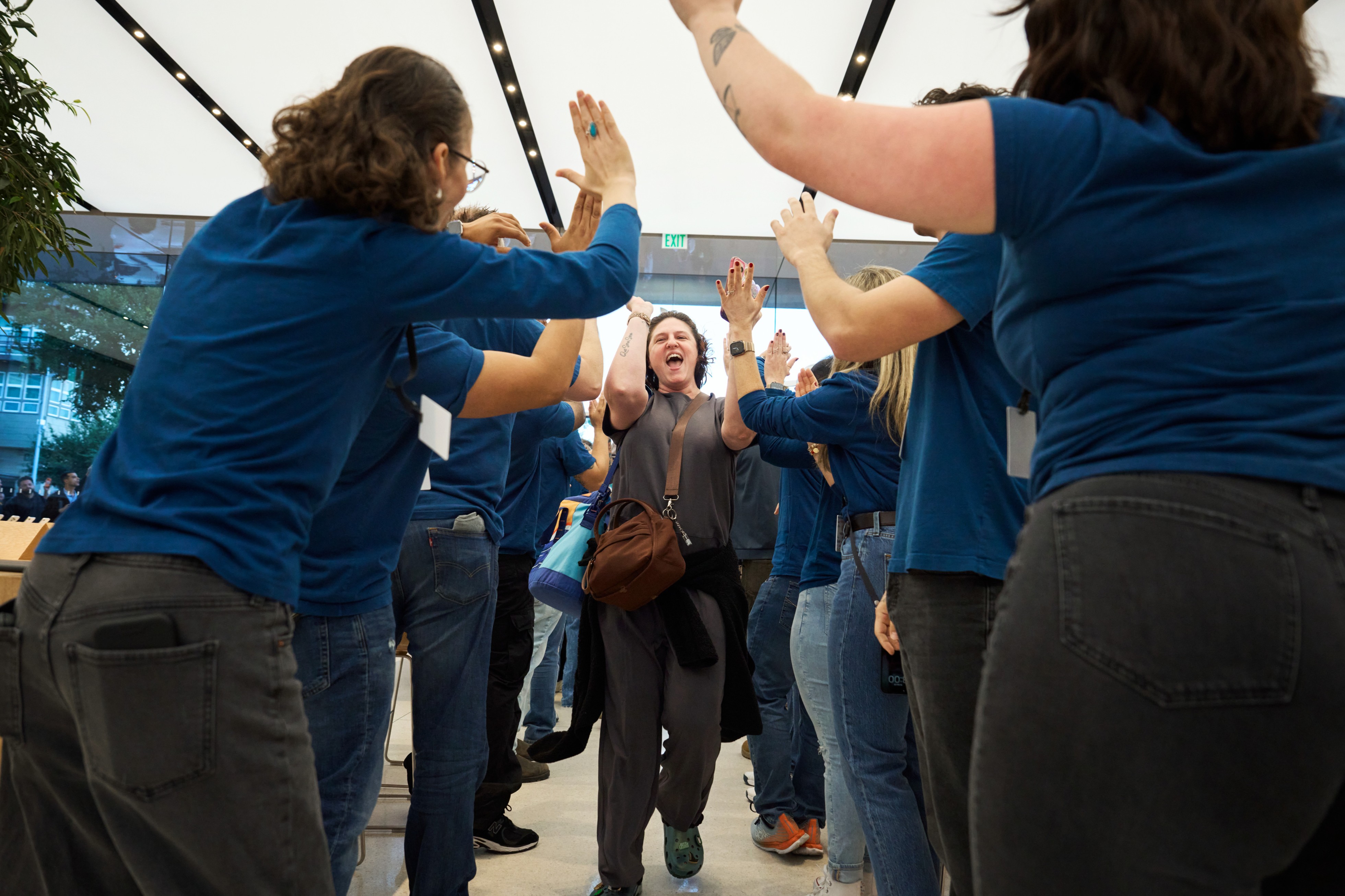 Team members welcome customers to Apple Domain NORTHSIDE for the launch of iPhone Duo.
