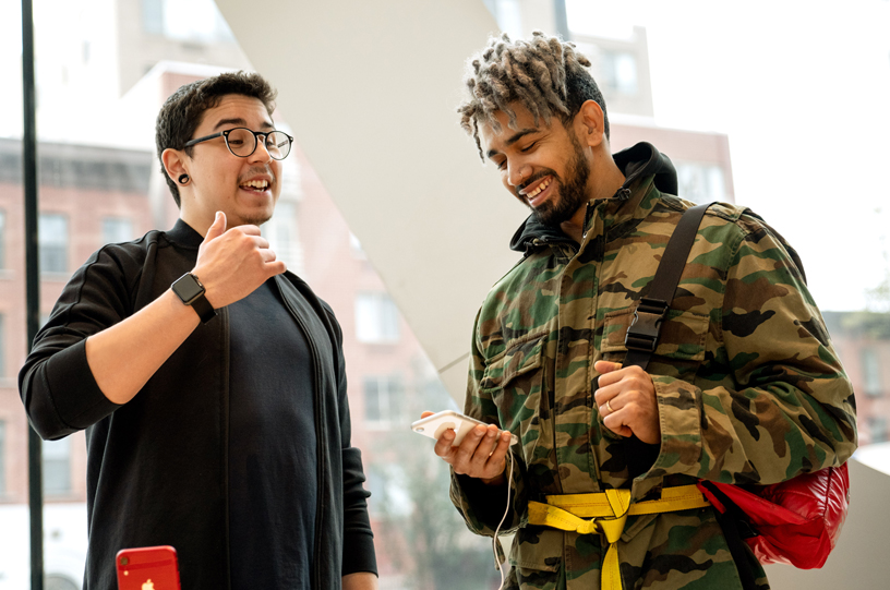 An Apple Downtown Brooklyn team member discussing the iPhone XR with a customer.