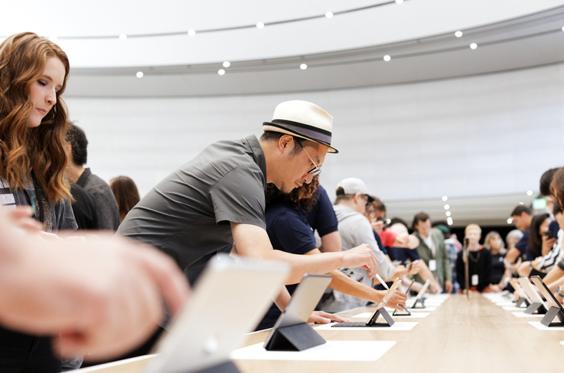 Guests at the hands-on area at Steve Jobs Theater.