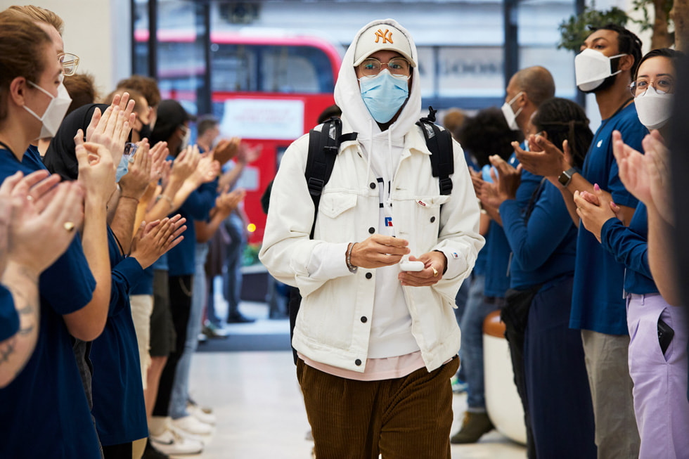 Team members at Apple Regent Street greet customers arriving for the iPhone 13 lineup. 
