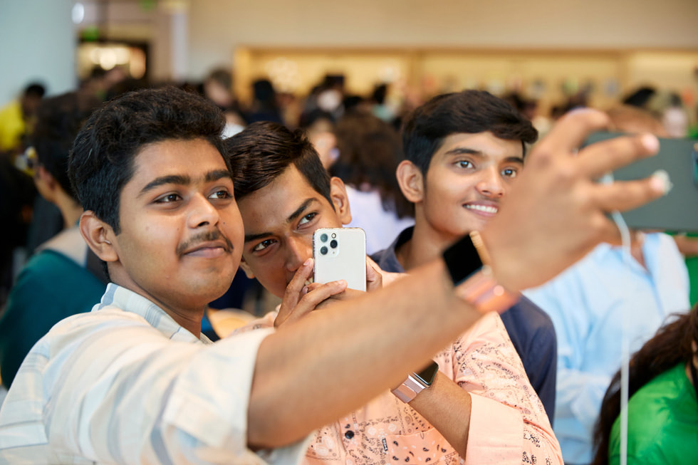 Customers pose for a group selfie. 