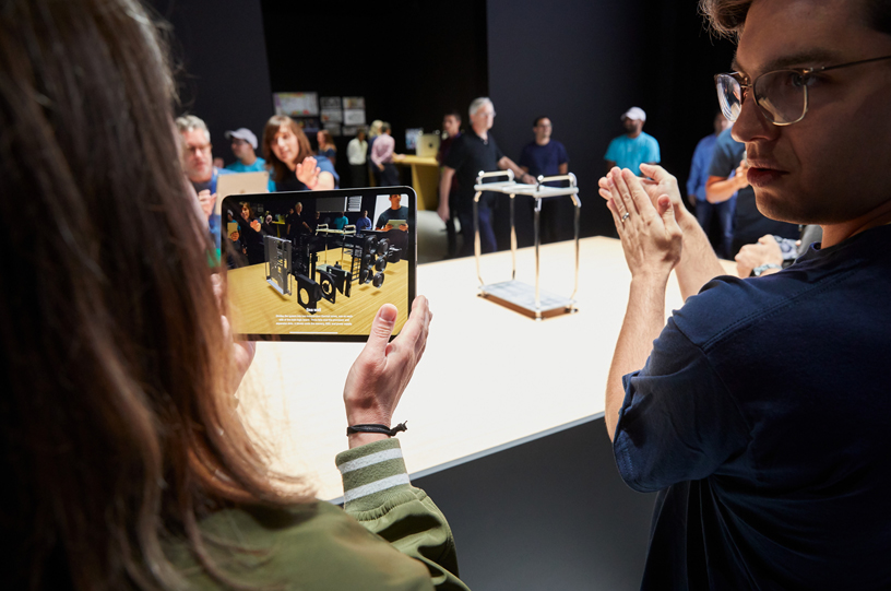 WWDC guest looking at AR screen on iPad.