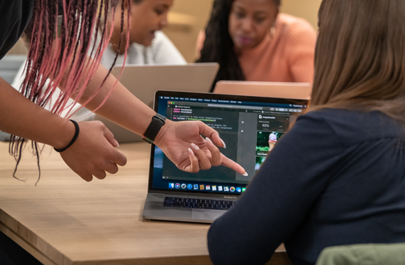 An Apple team member instructing a participant.