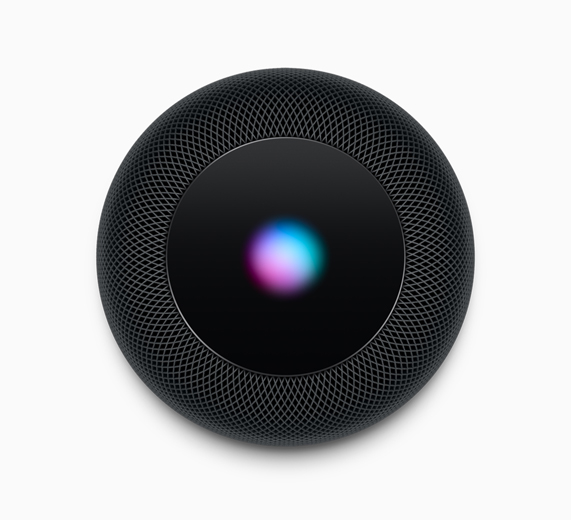 A photo showcasing the HomePod in space gray, viewed from the top down.