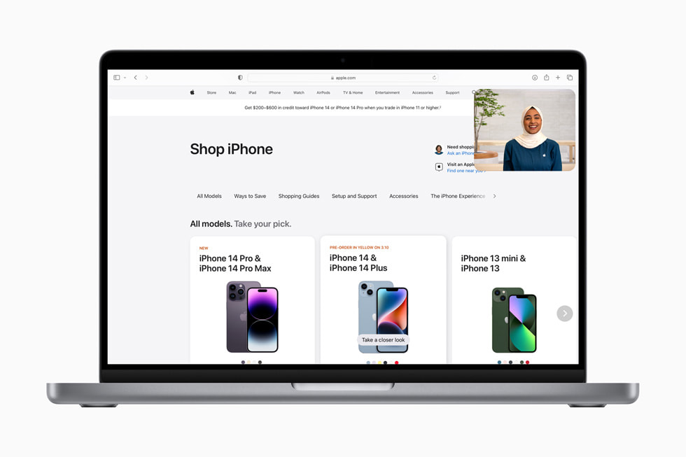 The Shop with a Specialist over Video experience is shown over an [apple.com] (https://applews.rehcb.com) page reading “Compare iPhone models” and showing iPhone 14 Pro Max, iPhone 14 Plus, and iPhone 14.