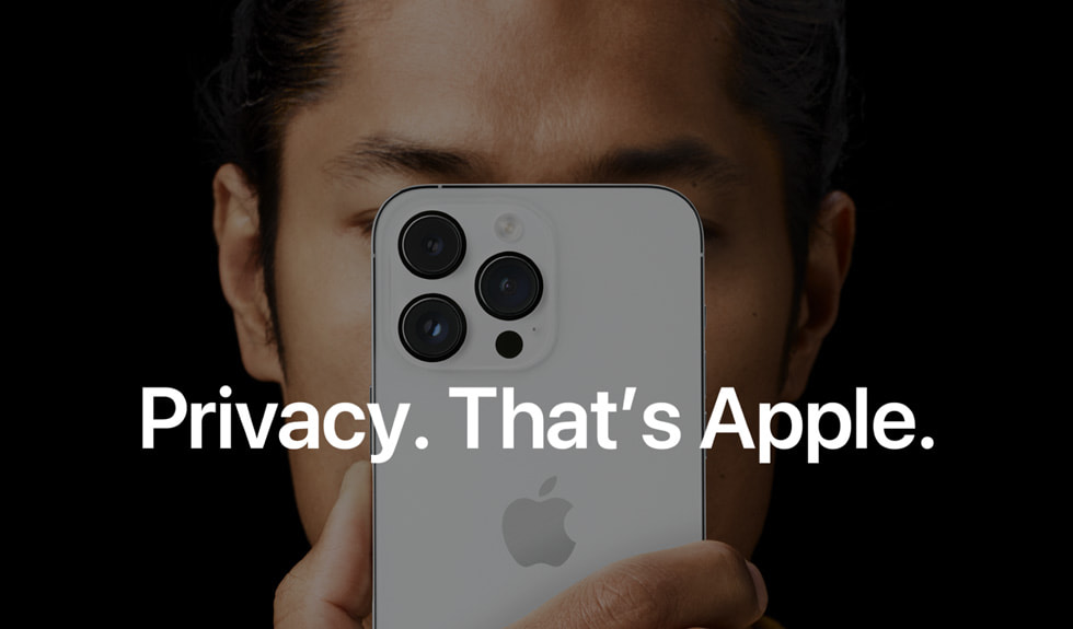 A man holds an iPhone in front of his face.