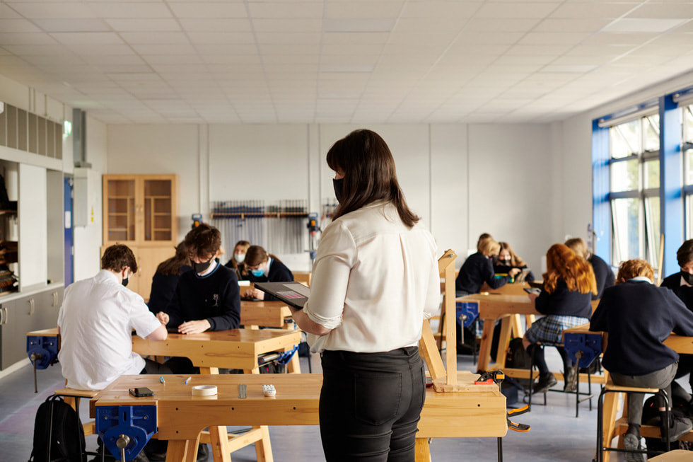 Teacher Lyndsey Balfe works with students in her classroom.