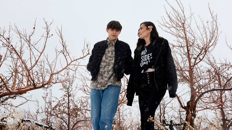 Micah and Kristian Toelupe walking together outdoors.
