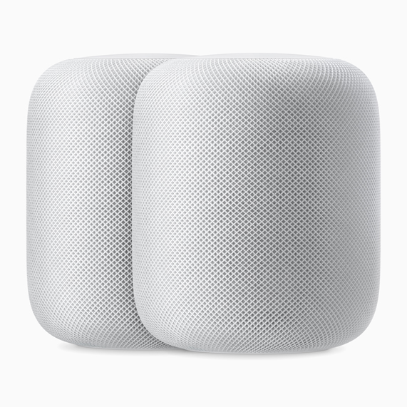 Dos bocinas HomePod en color blanco.