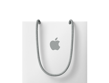 Bílá nákupní taška s logem Apple v horní části