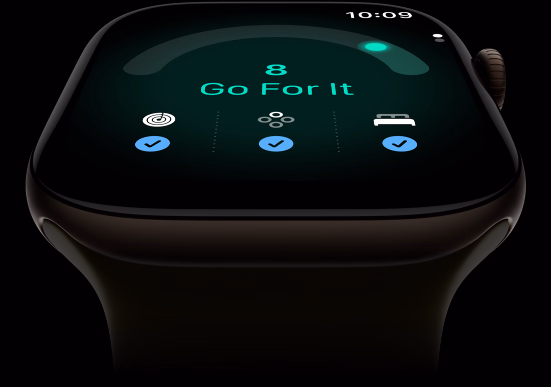 Apple Watch Series 12, pouzdro z tmavě bronzového hliníku, skóre připravenosti 8, na pravém boku korunka Digital Crown, olivový sportovní řemínek