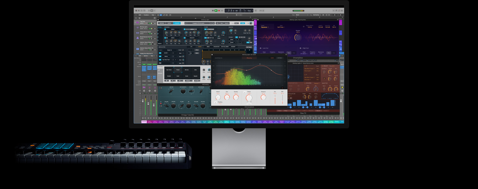 Mac Studio Display, layar menampilkan kontrol Logic Pro, papan ketik berada di sisi kiri bawah