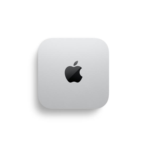 Mac mini, vista superior, muestra las dimensiones de 12,7 cm en el lado inferior y izquierdo del dispositivo. Está hecho de aluminio en plata, tiene forma cuadrada, esquinas redondeadas, logotipo de Apple en el centro en negro brillante.